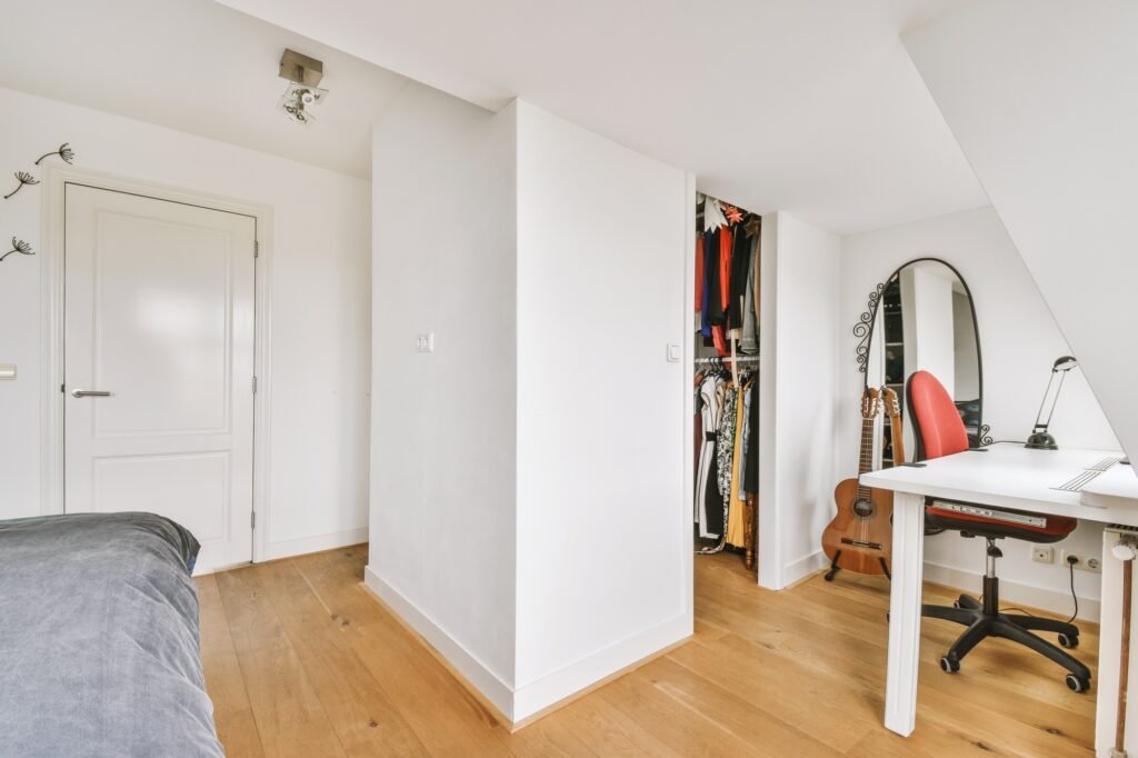 Loft bedroom with wooden floor